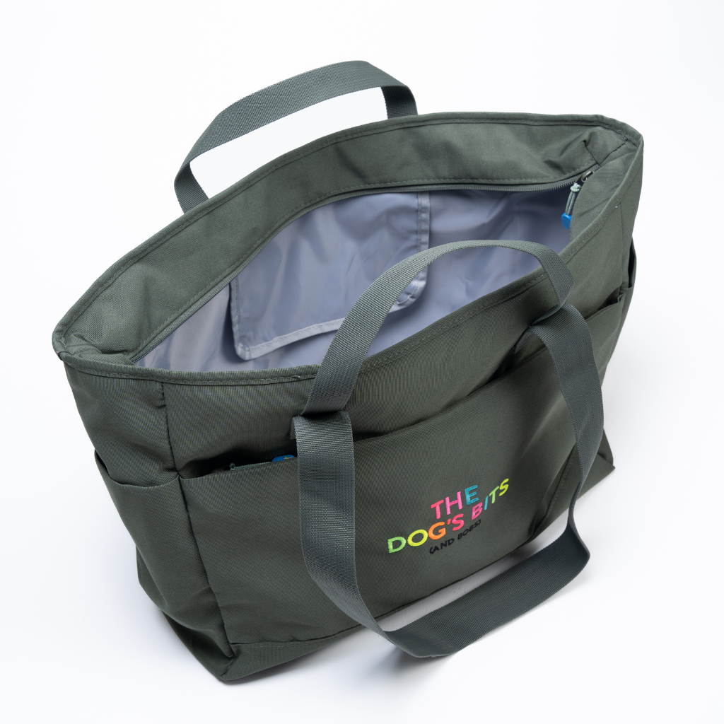 Green bag with 'The Dog's Bits' logo on a white background