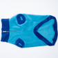 Blue dog sweater with a zipper on a white background