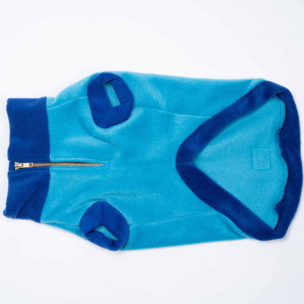 Blue dog sweater with a zipper on a white background