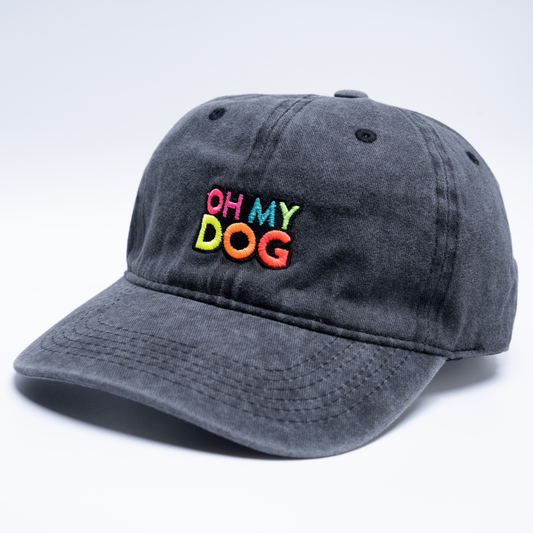 washed black cap with 'OH MY DOG' text in colourful embroidery 