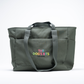 The Dog’s Bits recycled dog travel tote bag with multiple pockets and dual carry handles for holidays and weekends away.